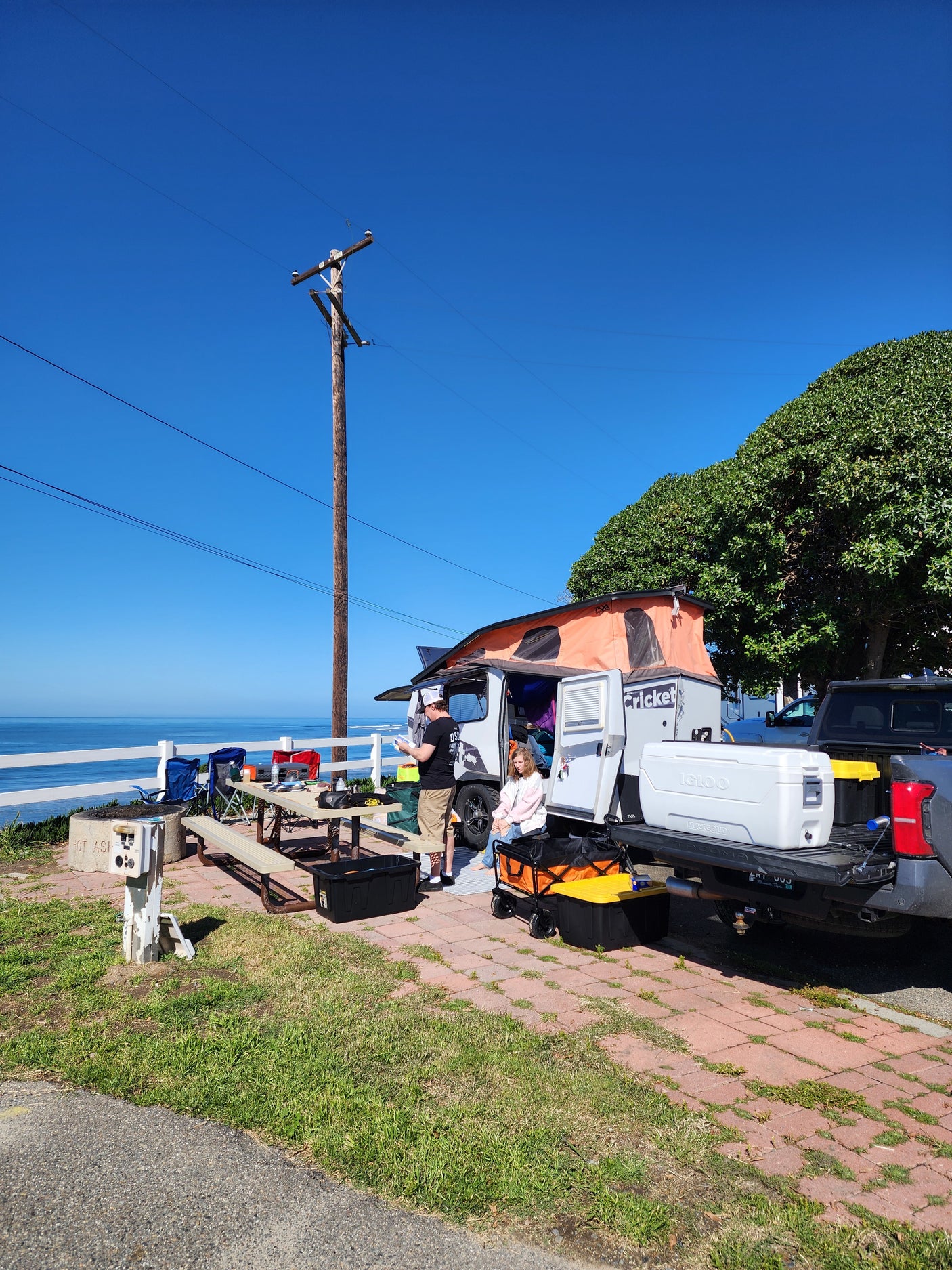 Family enjoying a scenic beachfront rv rental campsite with ocean views.