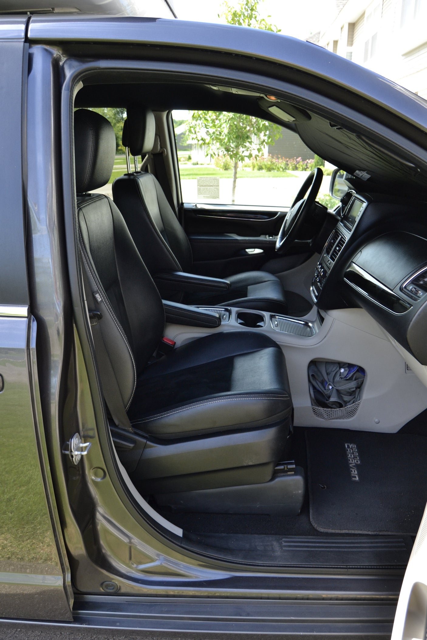 Inside a rental minivan: comfortable front seats, console, and dash. Great for travel; ask about RV rental!