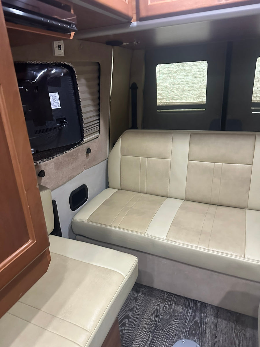ready for your next adventure.|Cozy RV rental interior with kitchen