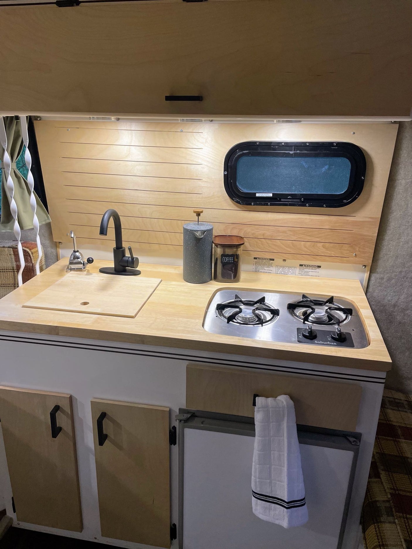 part of an RV rental family adventure.|Cozy RV rental interior: wood dining table