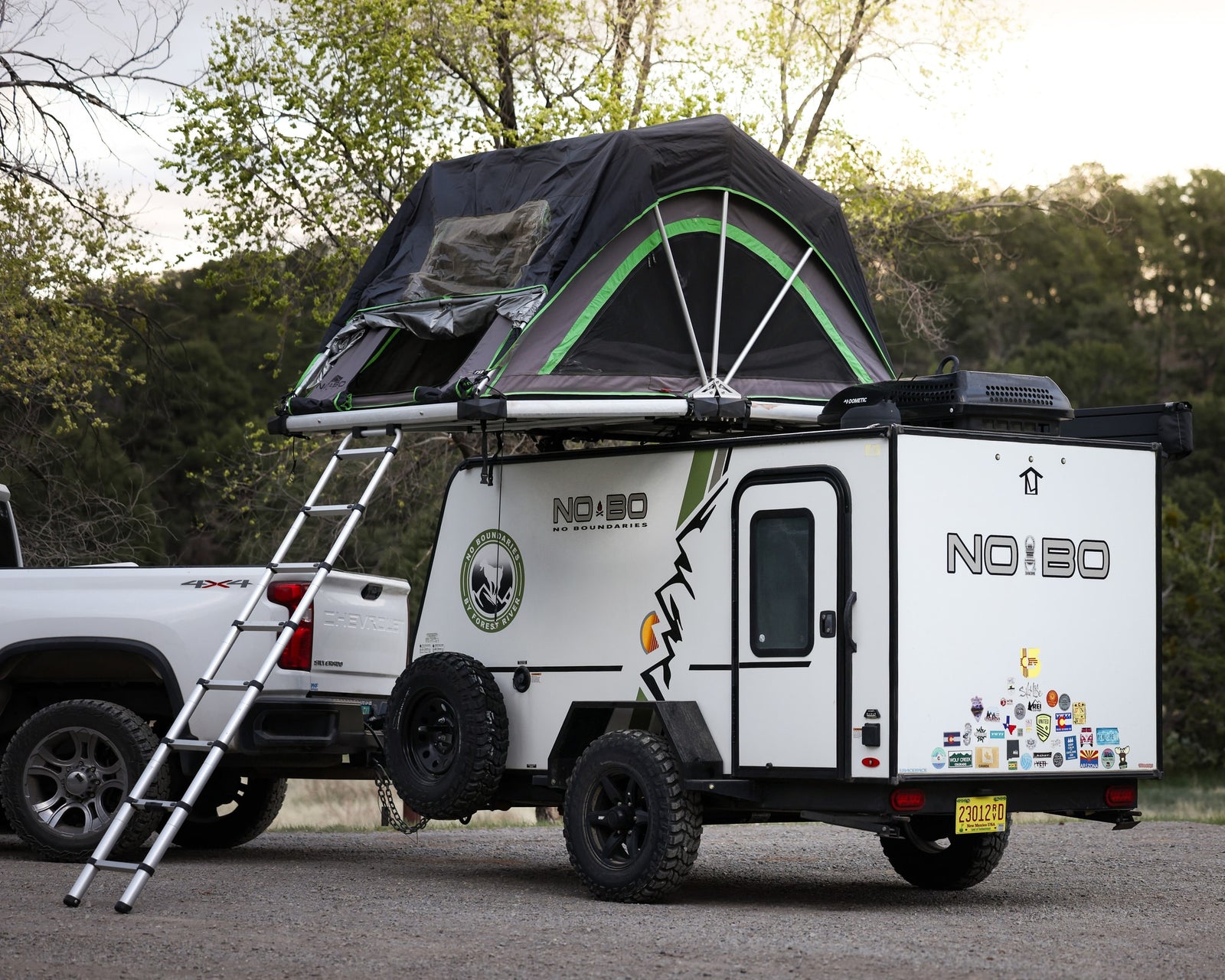 equipped with a roof tent and towed by a 4x4
