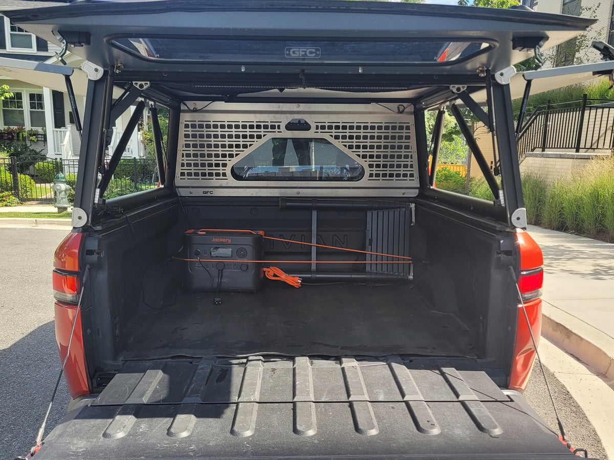 ready for an RV rental adventure.|Orange Rivian R1T electric truck with a GFC camper — photo 11