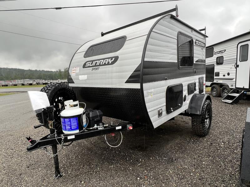 This compact gray and black Sunray Sport travel trailer
