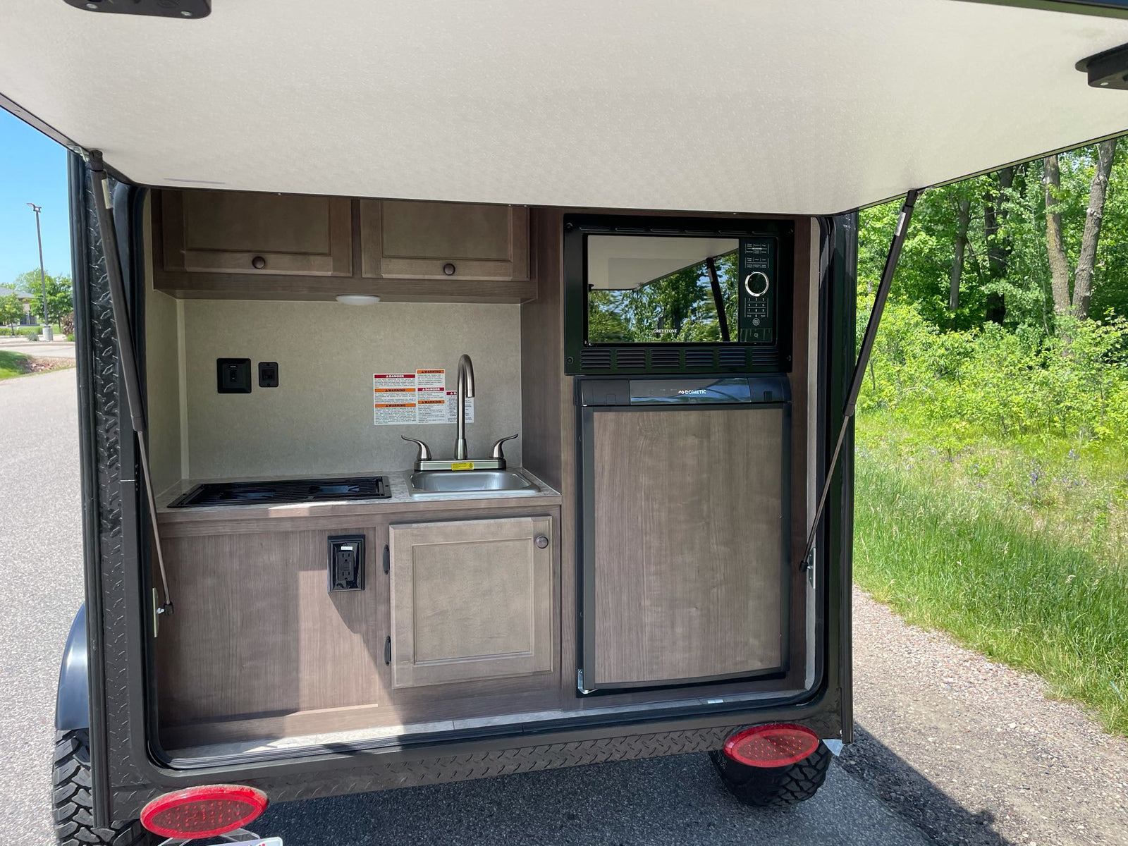 ready for an RV rental adventure.|Compact RV rental kitchen with sink