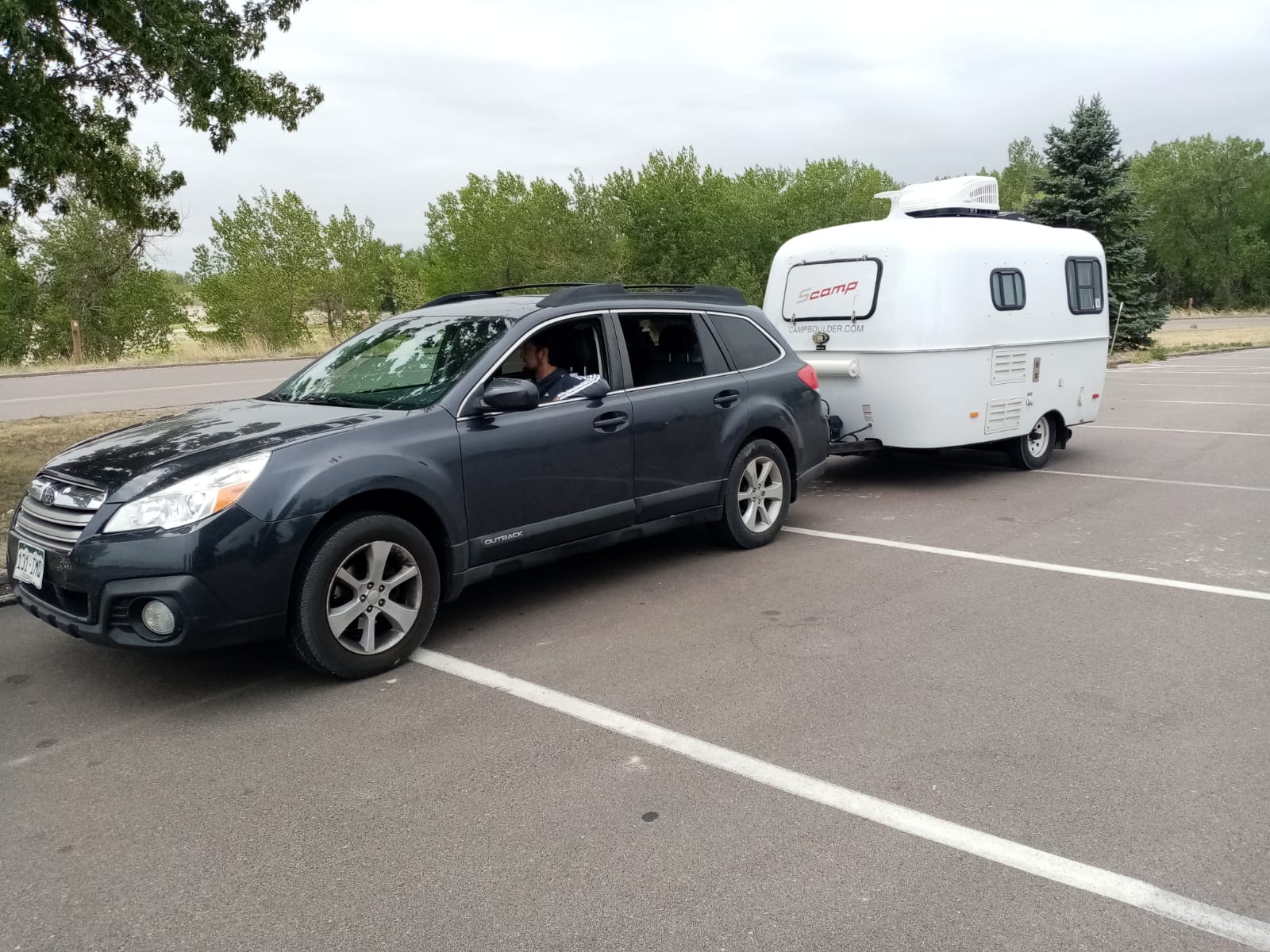 parked at a sunny campsite. Ideal for an rv rental adventure.|This teardrop RV rental camper