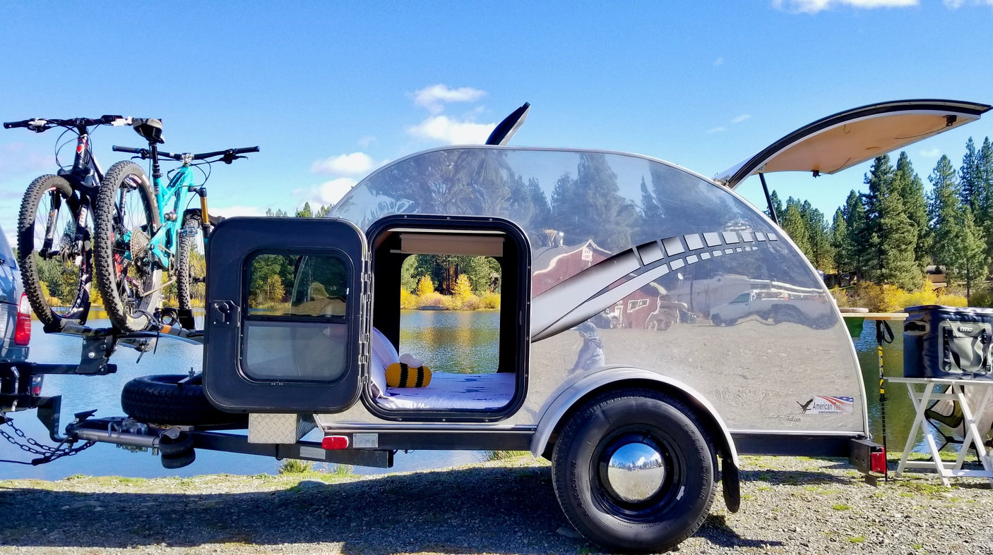 a shiny teardrop trailer