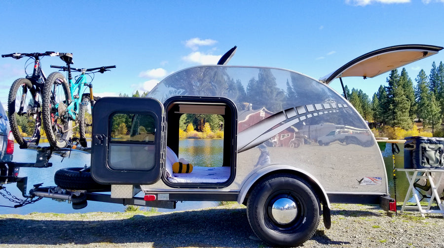 a shiny teardrop trailer