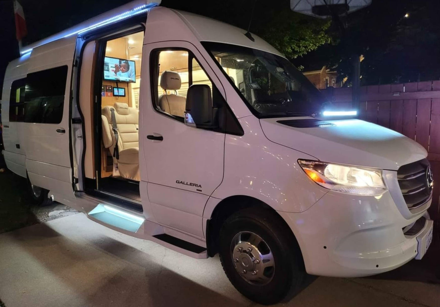 White luxury Galleria RV van at night