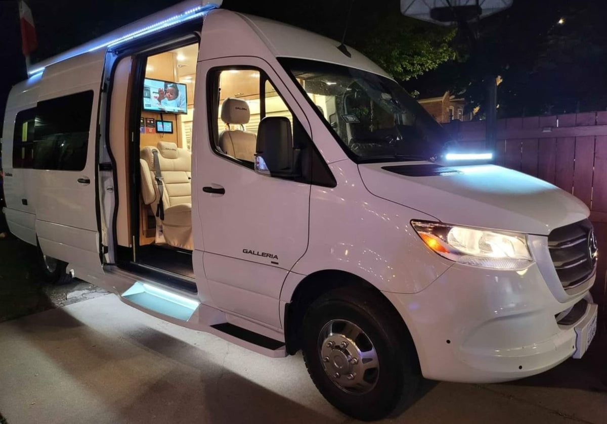 White luxury Galleria RV van at night