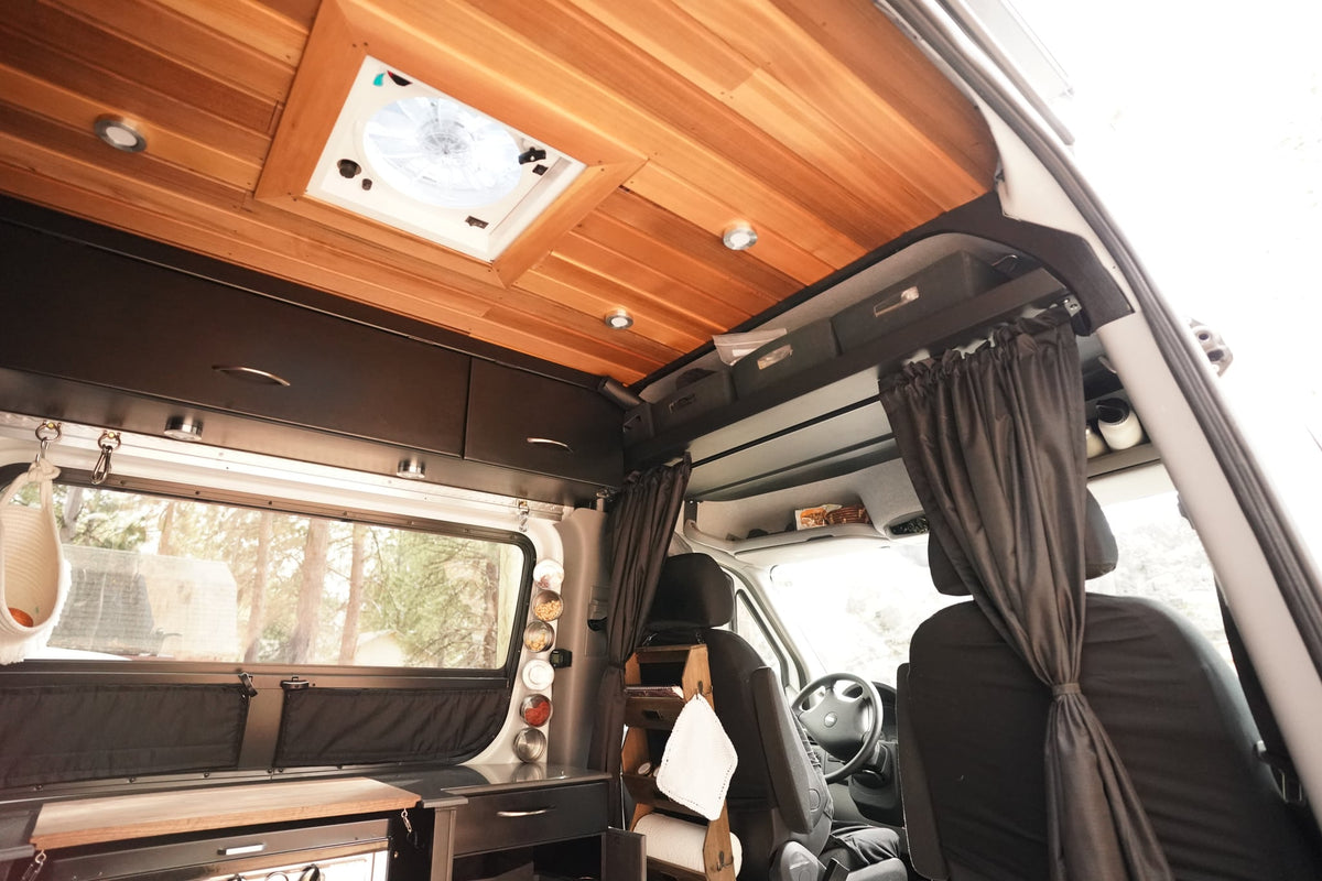 perfect for mobile travel.|Cozy RV rental interior: bedroom with wooden ceiling — photo 4