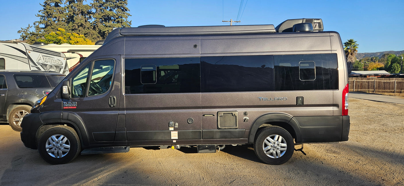 Grey Thor Tellaro camper van for rv rental. Parked outside with other RVs, ready for your next adventure.