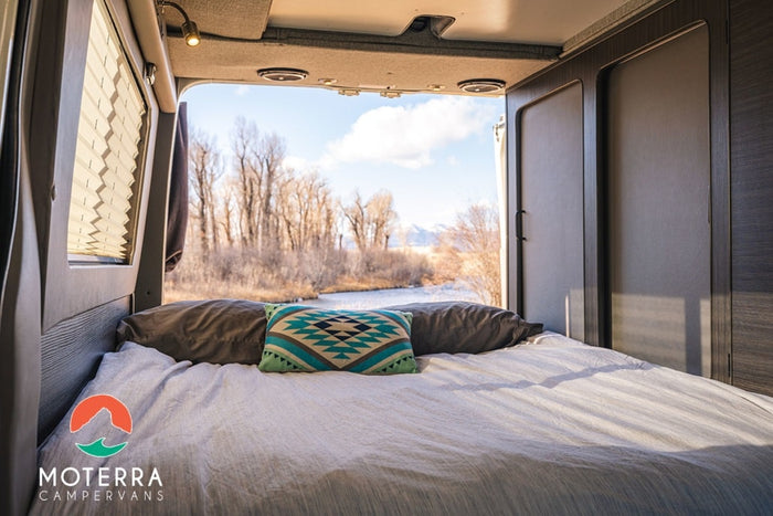 Enjoy incredible views from your comfortable RV rental bed. This camper van offers scenic nature escapes by the river.