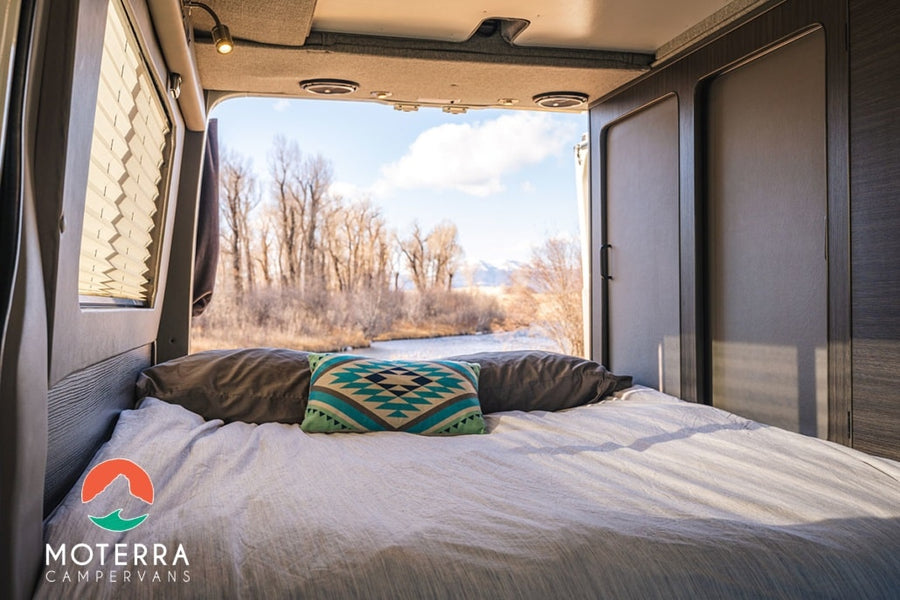 Enjoy incredible views from your comfortable RV rental bed. This camper van offers scenic nature escapes by the river.