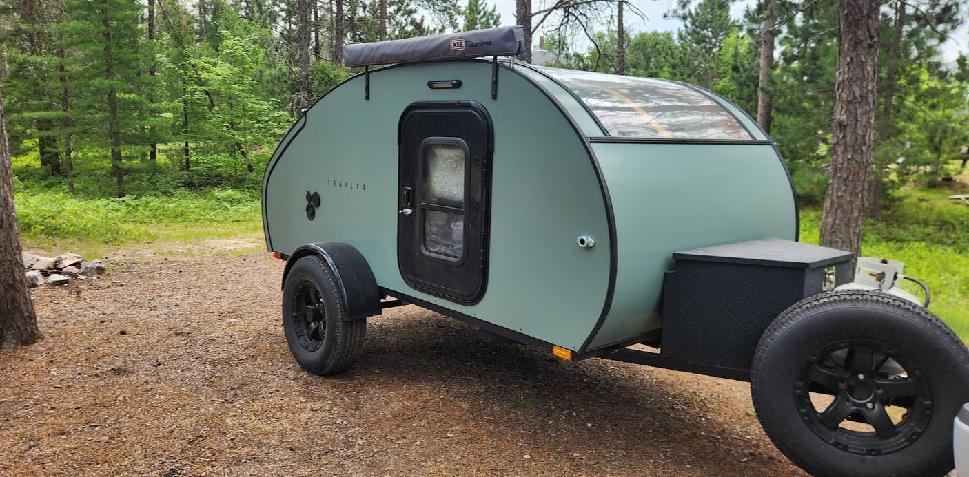 This mint green teardrop trailer