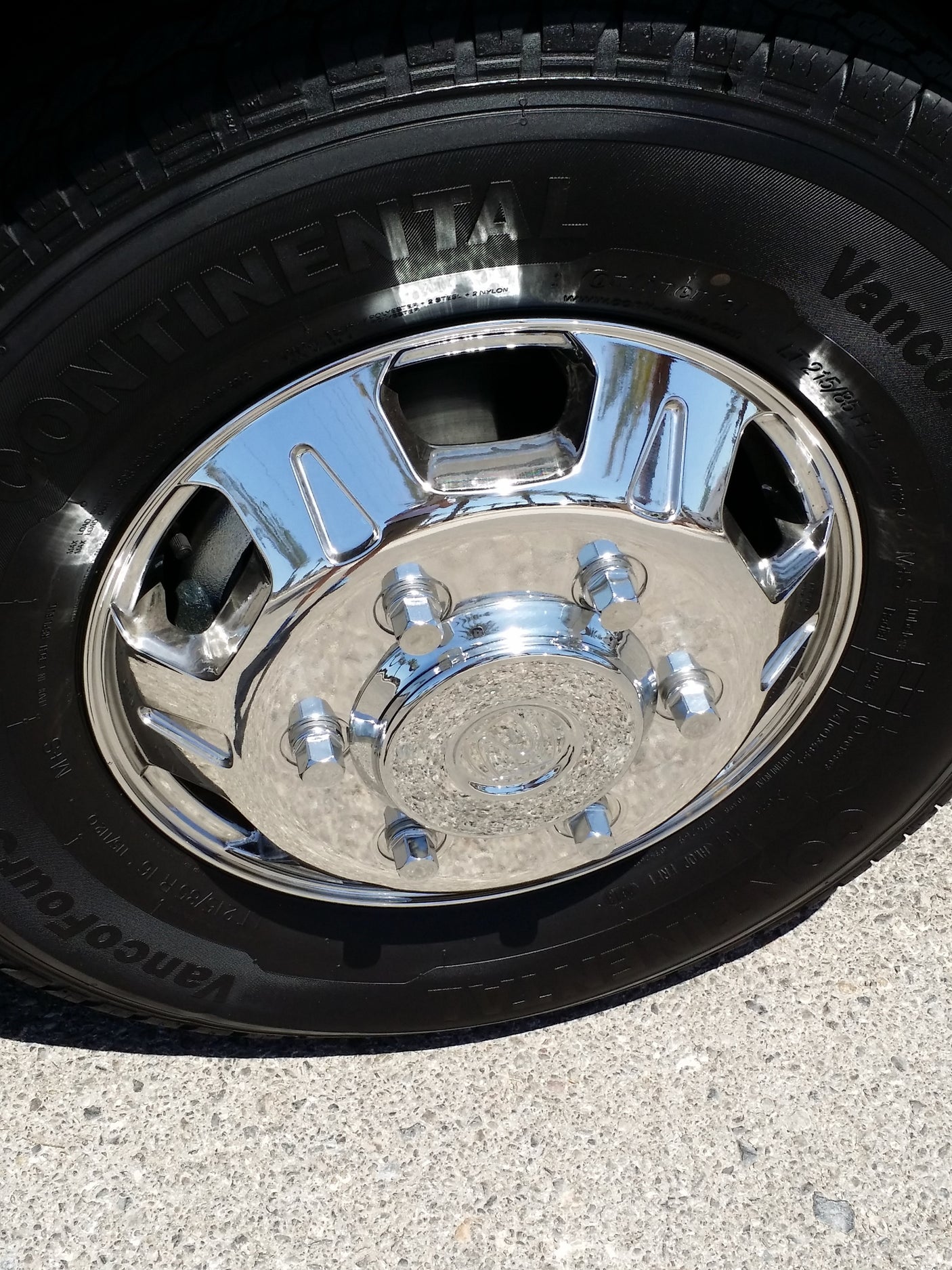 A new Continental tire and gleaming chrome wheel, ready for a reliable rv rental adventure on the road.