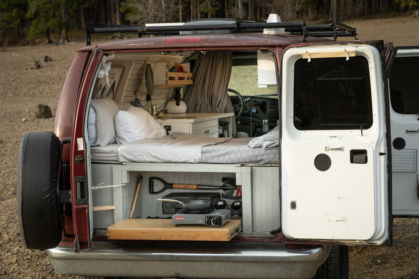 and clever storage.|Experience van life with this RV rental! Functional camper van interior featuring a kitchen — photo 3