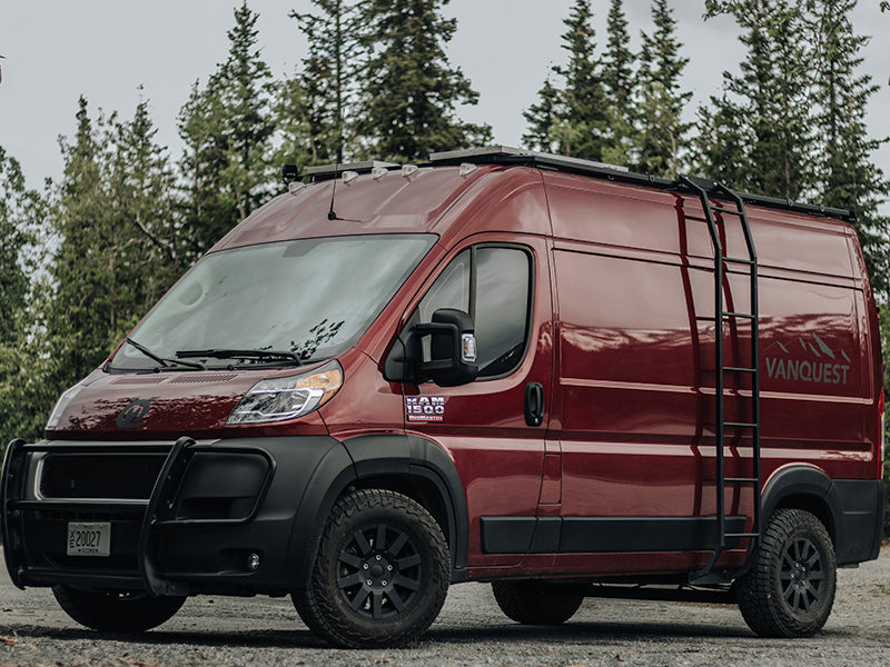 Experience adventure! This rugged maroon Ram ProMaster camper van, with a roof rack & ladder, is a great **RV rental** option.