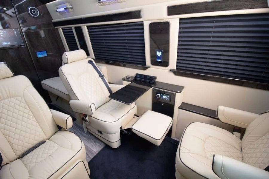 and steering wheel.|Spacious luxury interior of a custom van