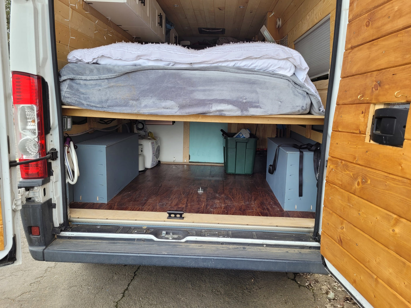 and smart storage inside a camper van.|Inside an RV rental: custom campervan control panel for power/heating — photo 10