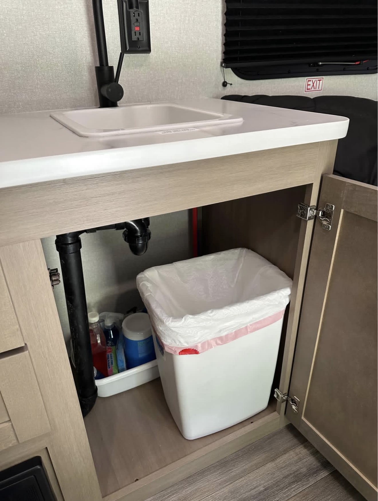 and camping essentials by an RV rental. Ready for adventure!|RV rental's compact mini-fridge
