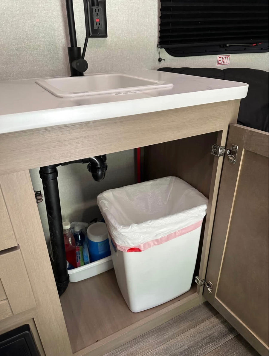 and camping essentials by an RV rental. Ready for adventure!|RV rental's compact mini-fridge