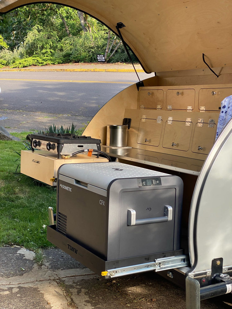teardrop RV rental trailer on a street
