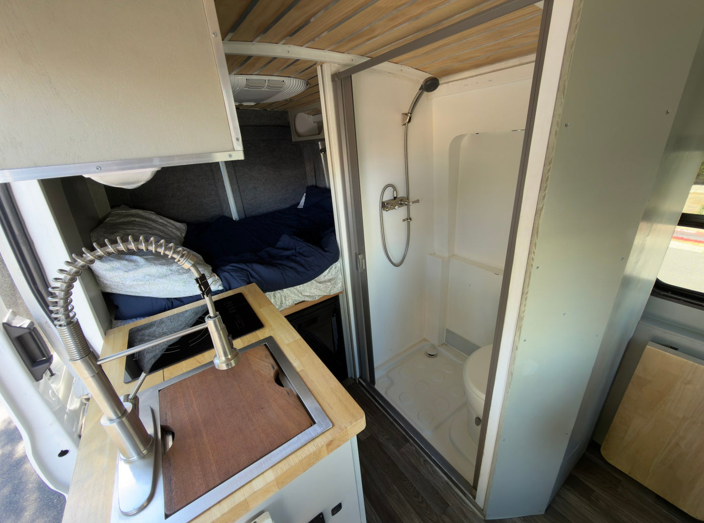 parked on a sunny street.|White camper van — photo 2