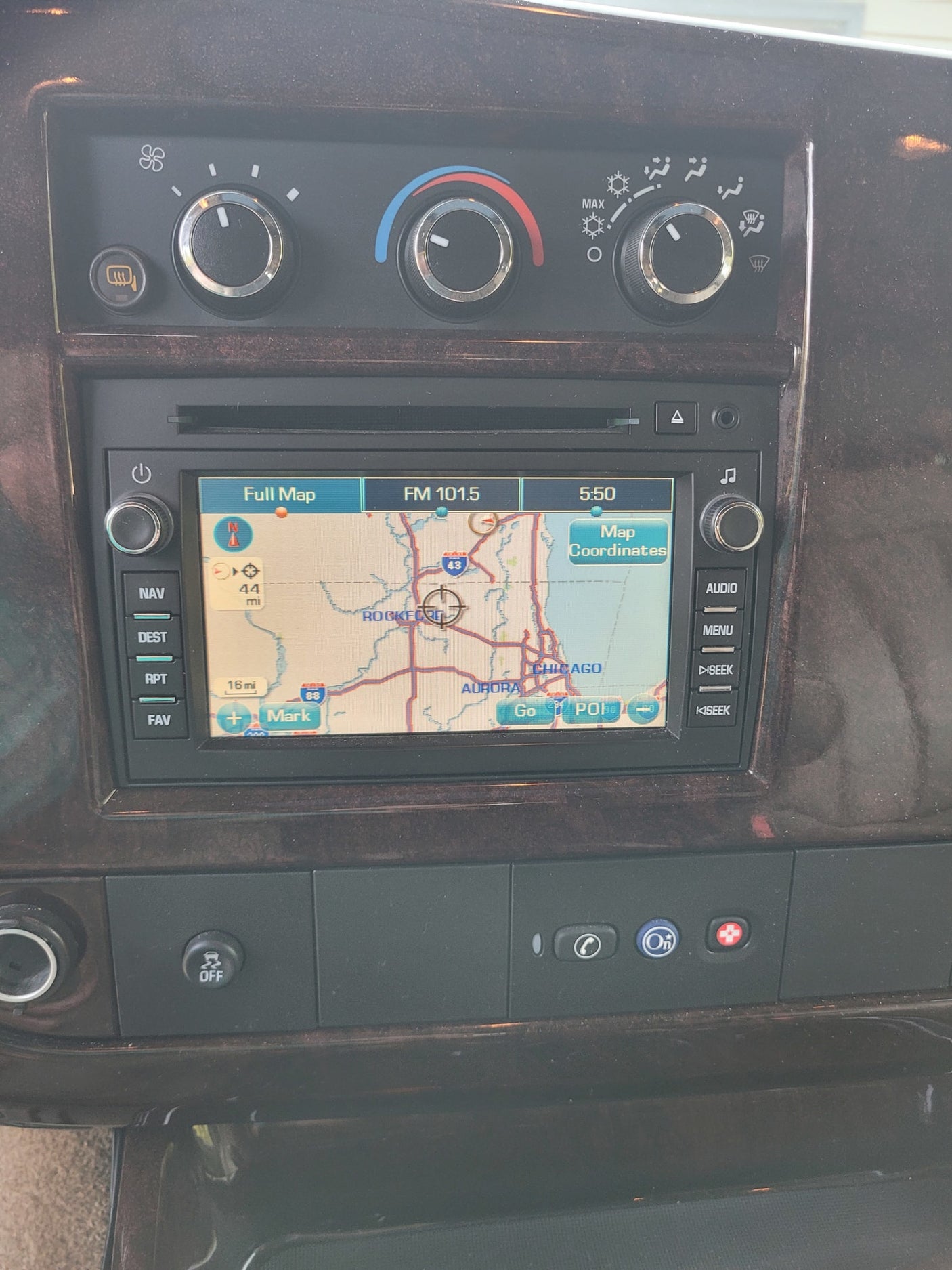 including climate controls & navigation display with a map near Chicago.|Inside an RV rental