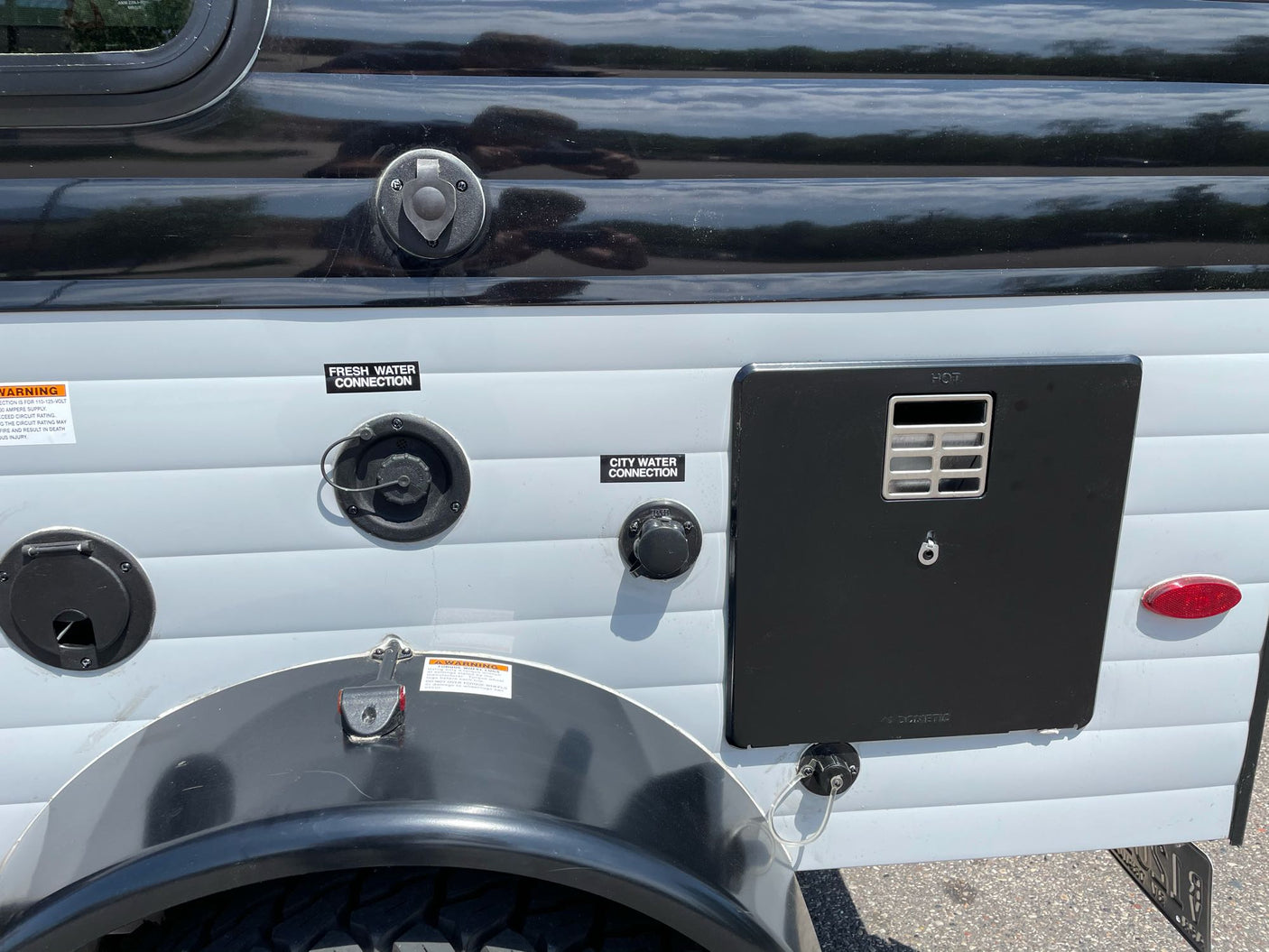 perfect for camping adventures.|Sunray Sport RV rental showcases its outdoor kitchen: sink