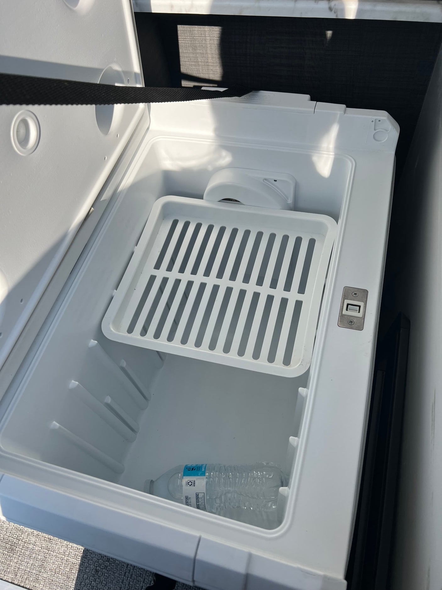 parked under a blue sky. Ready for your next outdoor camping trip.|Inside an RV rental's portable fridge