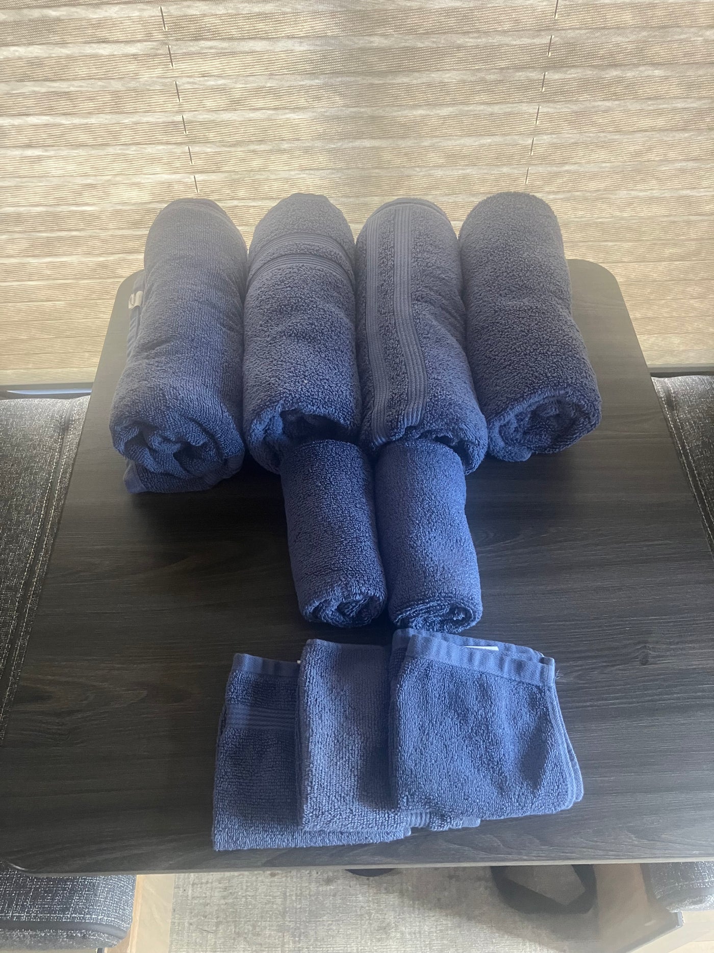 Neatly arranged blue towels, ready for use in your RV rental. Practical comfort in a compact space. — photo 4