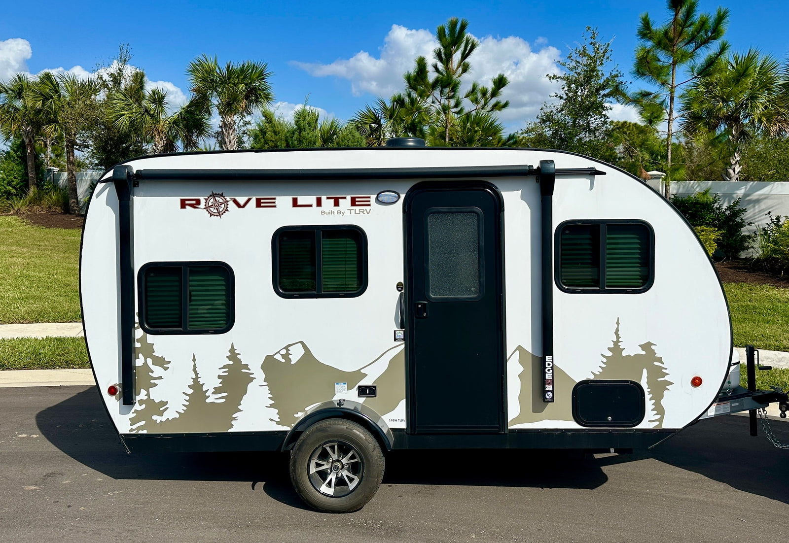 Explore with this white Rove Lite tear-drop RV rental