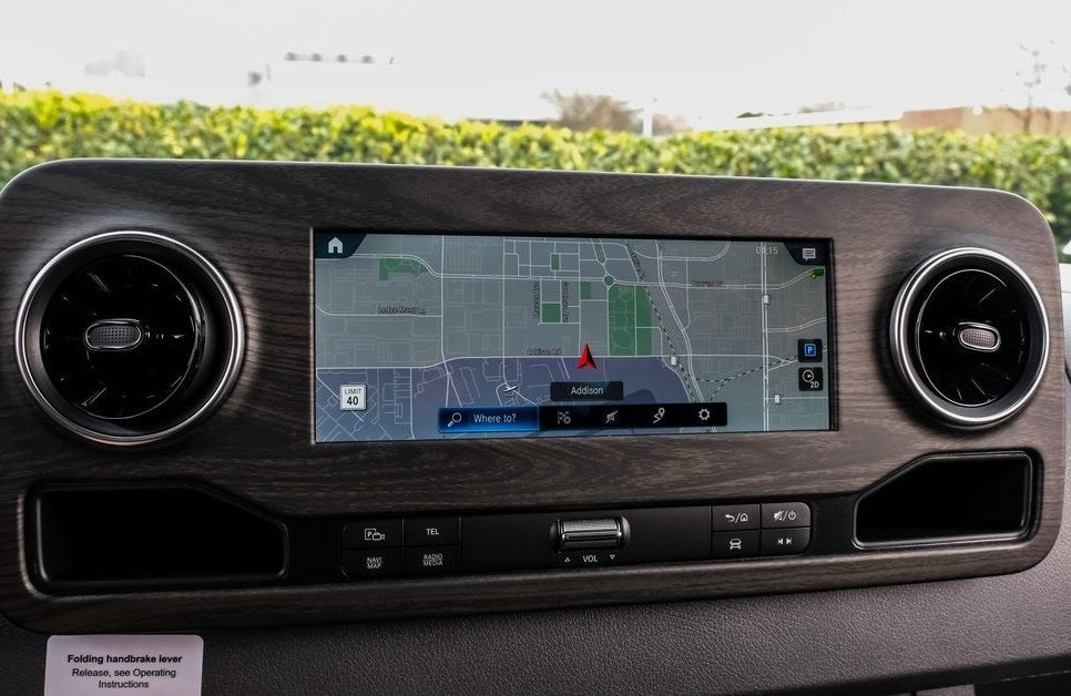 and dashboard.|This matte black adventure RV rental — photo 8