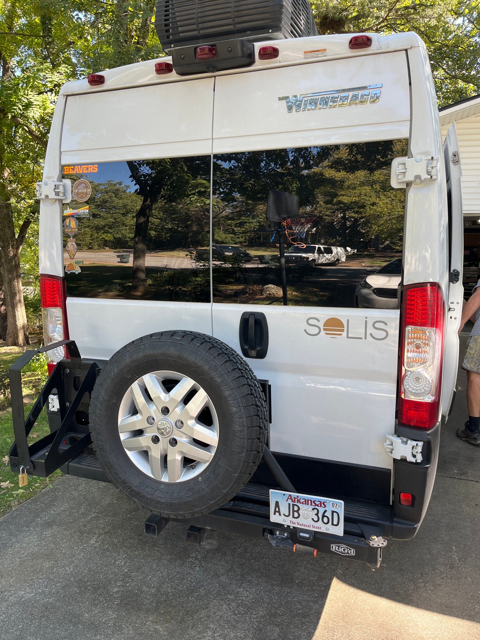 and controls.|White Winnebago RV (Ram ProMaster chassis) parked on a concrete driveway