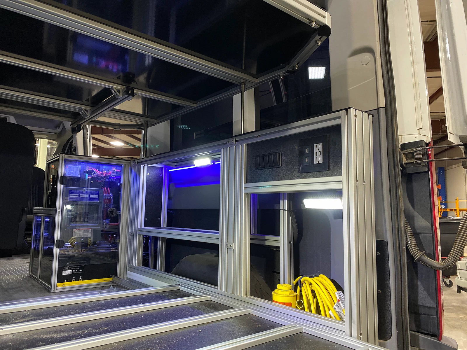 and a custom tech setup.|This RV rental features a custom van interior with modular storage