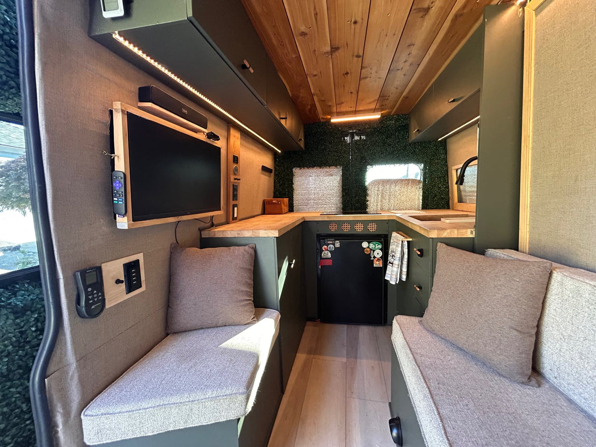 Inviting RV rental interior with green cabinetry — photo 1