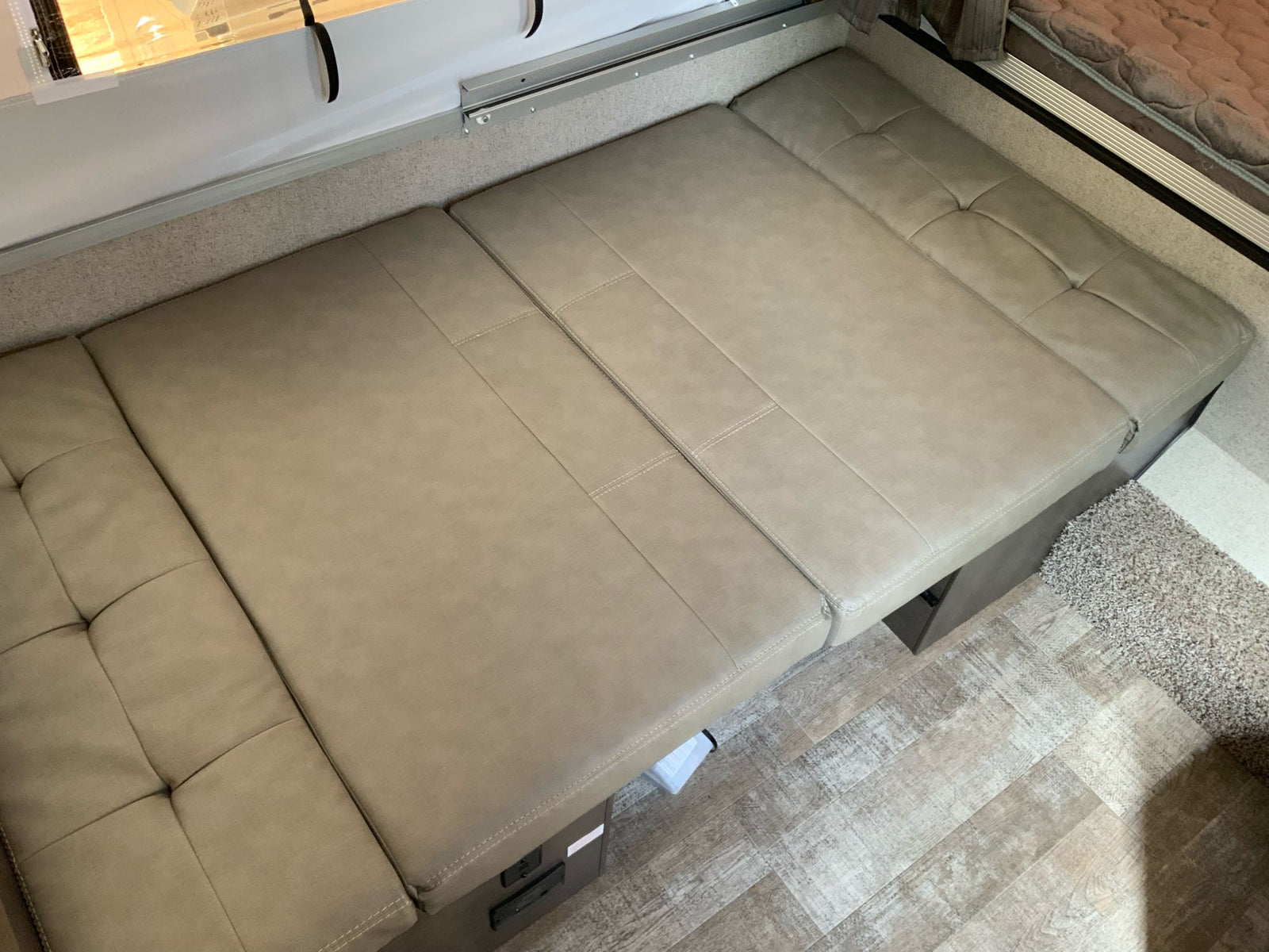 and living area. Perfect for travel and camping adventures.|This compact pop-up RV rental