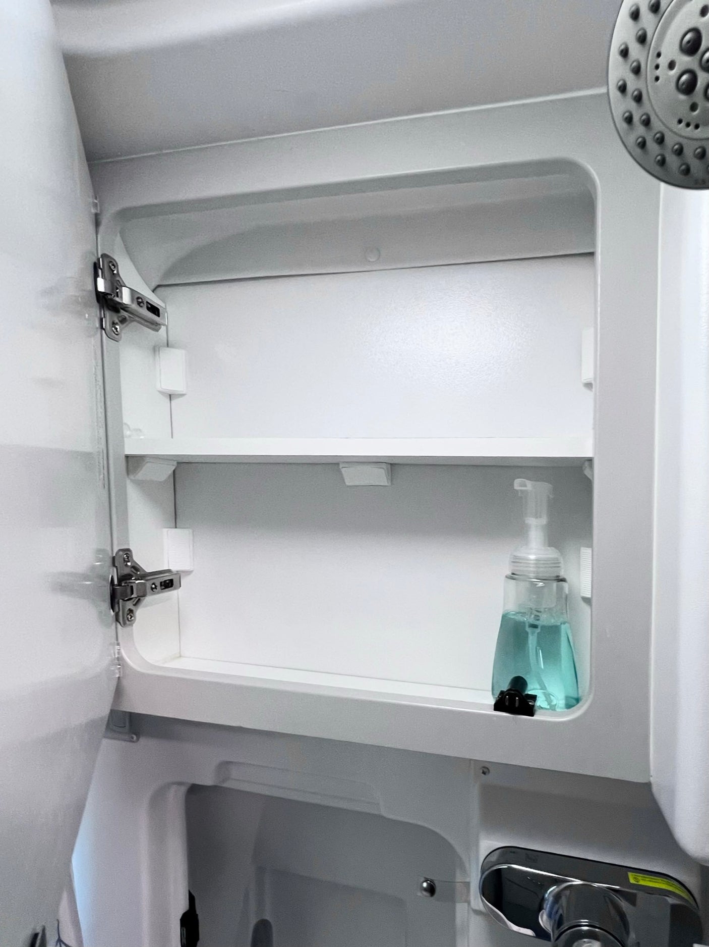 phone & notebook.|Plush comfort in your RV rental: a soft white backrest