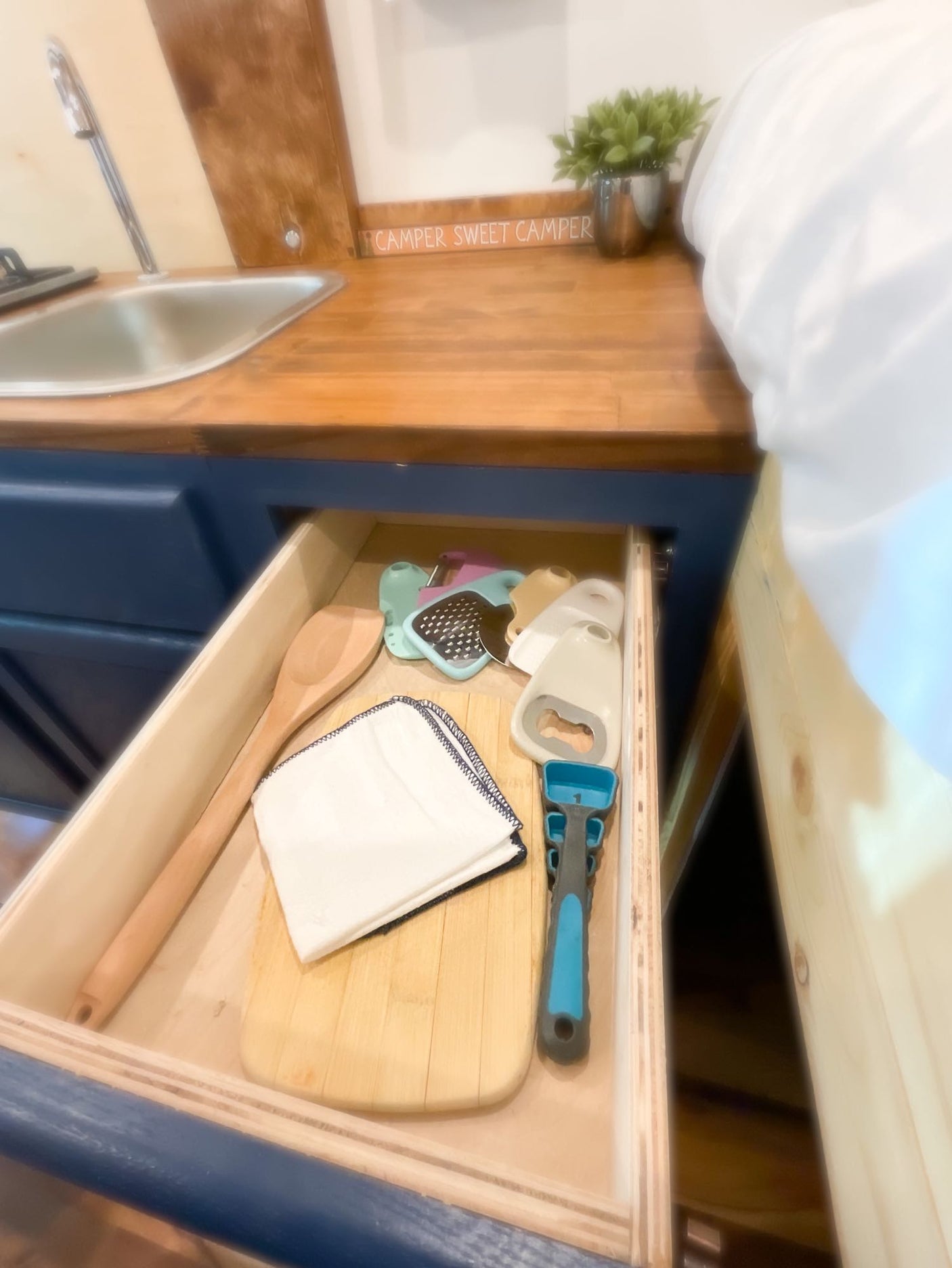 and storage. Ideal RV rental for adventure.|Spacious RV rental interior featuring a full kitchenette with sink and stove