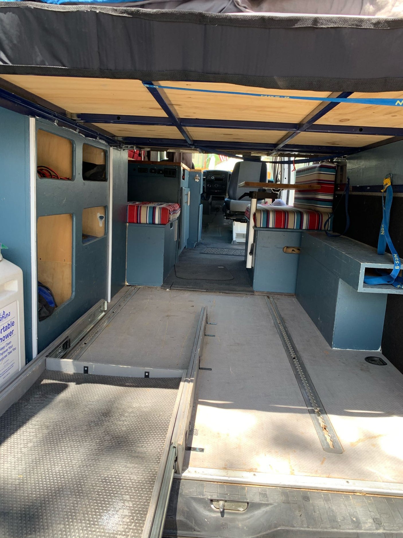 and striped bench seating for your adventures.|White Dodge Sprinter van