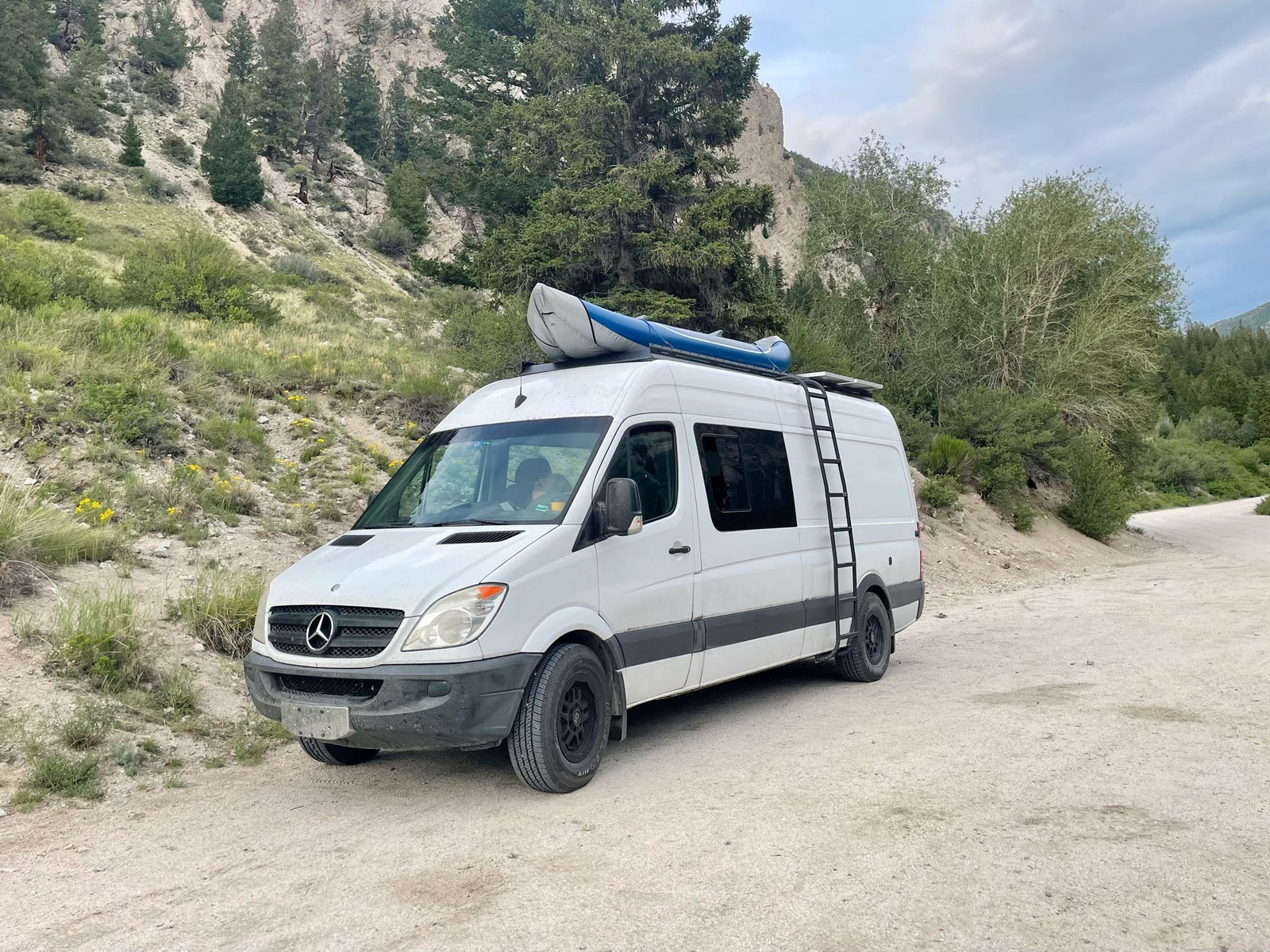 cloudy sky.|This white Sprinter rv rental