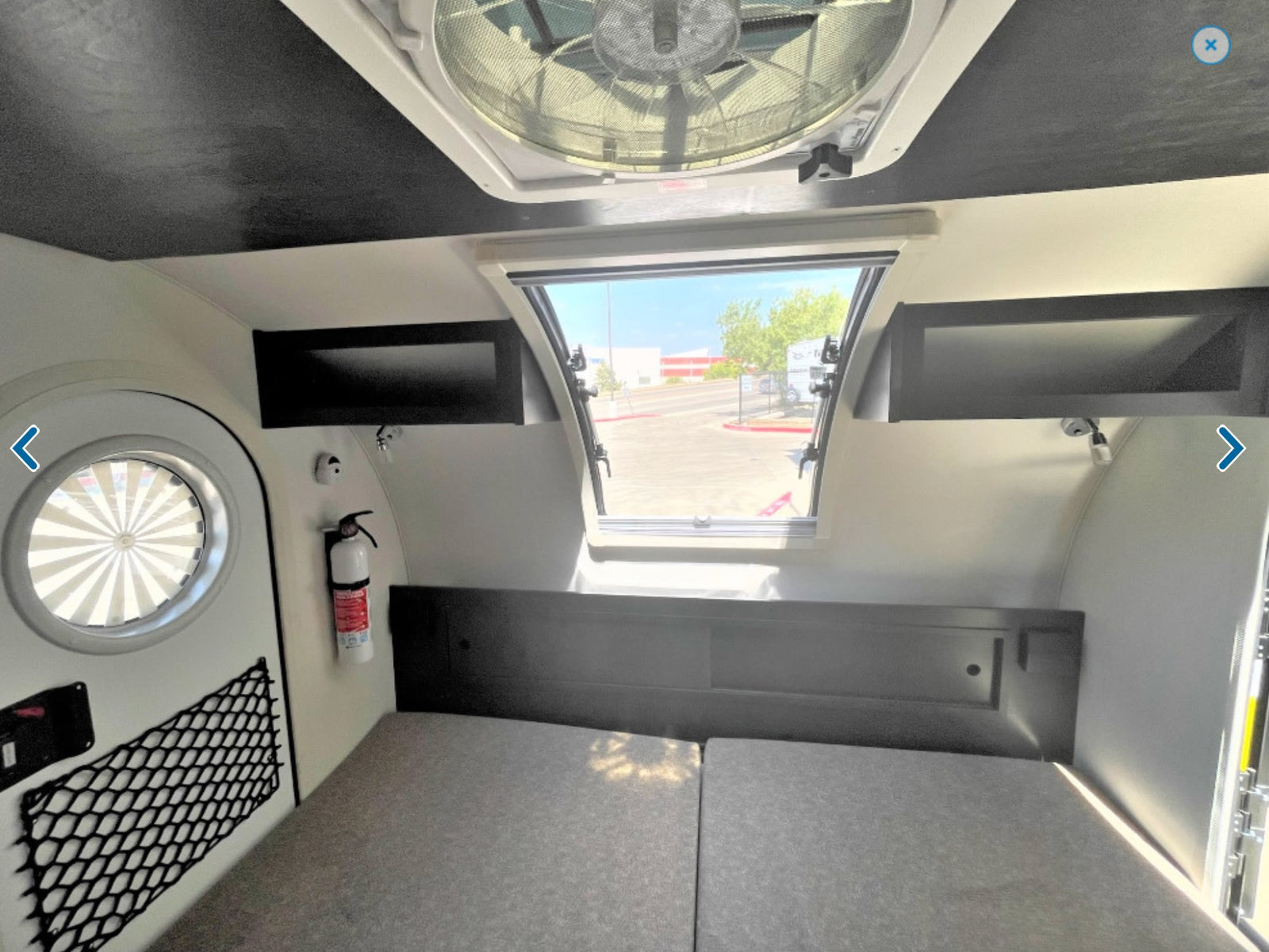 & counter space. Ready for adventures!|Inside an RV rental: a camper bedroom with mattresses