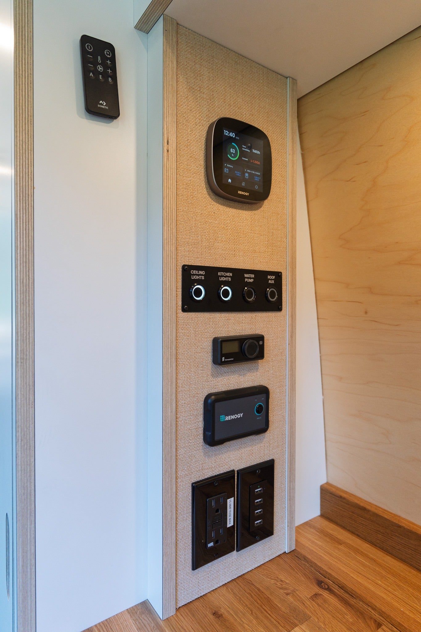 RV rental control panel: Dometic remote, Renogy battery monitor, Eberspacher, lights, water pump, USB/AC outlets.