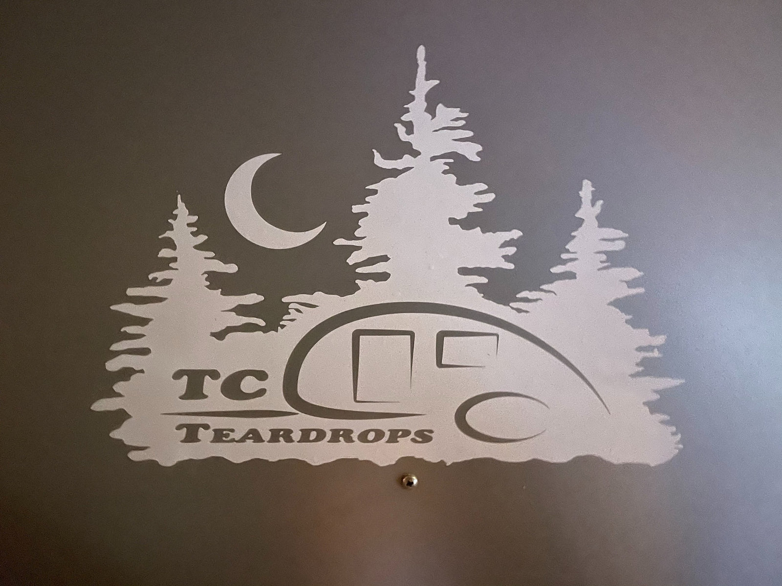 a teardrop camper with an outdoor kitchen. Ideal for easy outdoor living.|Cozy RV rental bedroom with a comfy bed