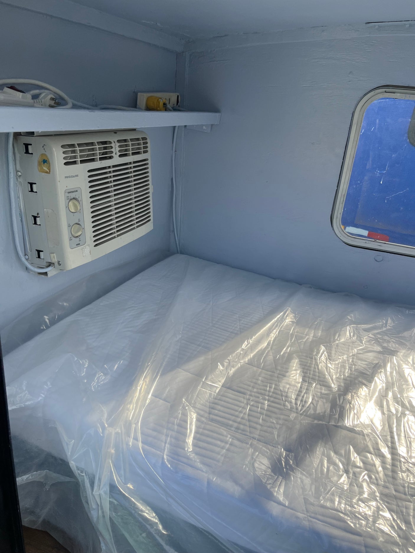 Get comfortable in our RV rental! This cozy sleeping space features AC, a power strip, and a fresh mattress.