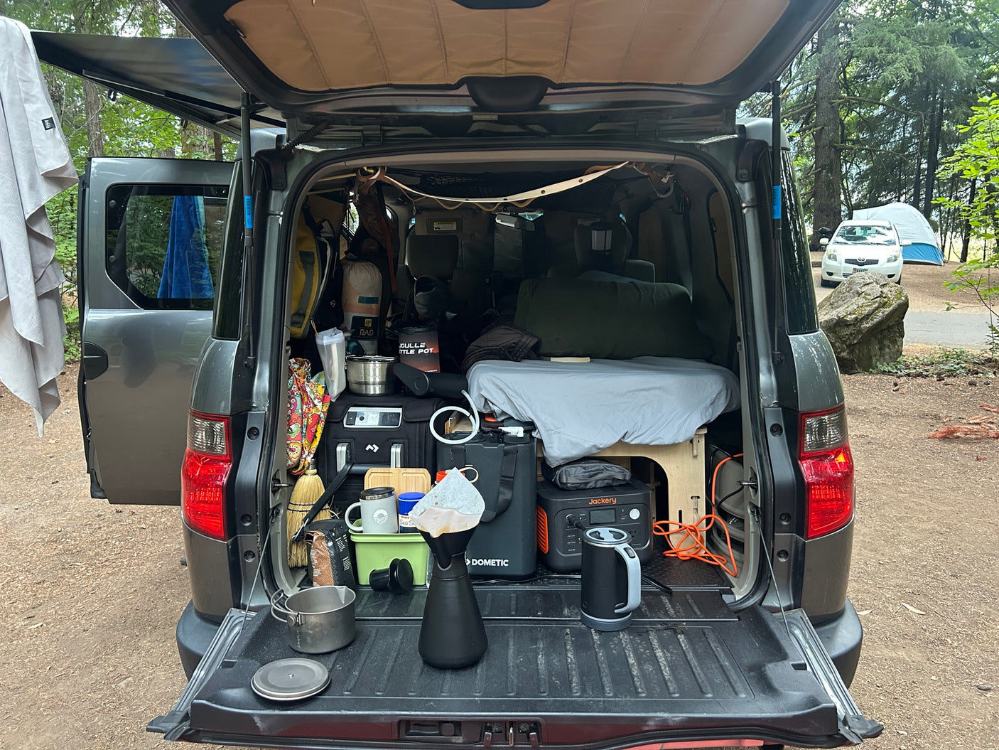 Ultimate car camping setup in a custom Element with portable kitchen & bed. A versatile RV rental alternative for adventures.