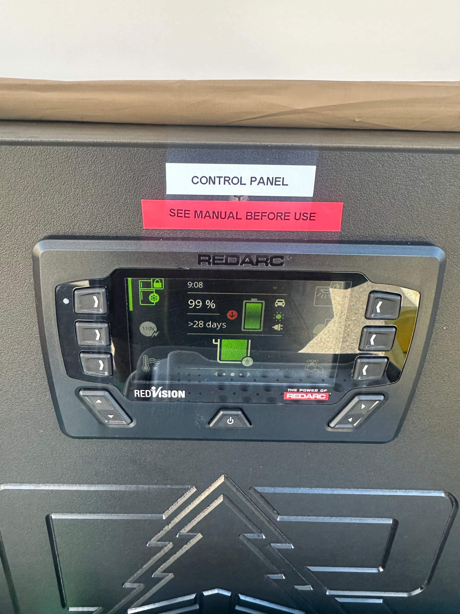 This RV rental's Redarc control panel shows battery power at 99%, with >28 days remaining for off-grid adventures.