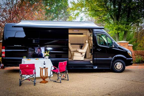Experience a luxury RV rental! Black van with open side