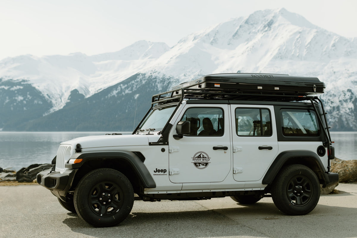 White Jeep Wrangler RV rental with rooftop tent by an Alaskan lake. Explore snowy mountains & wild landscapes. — photo 3