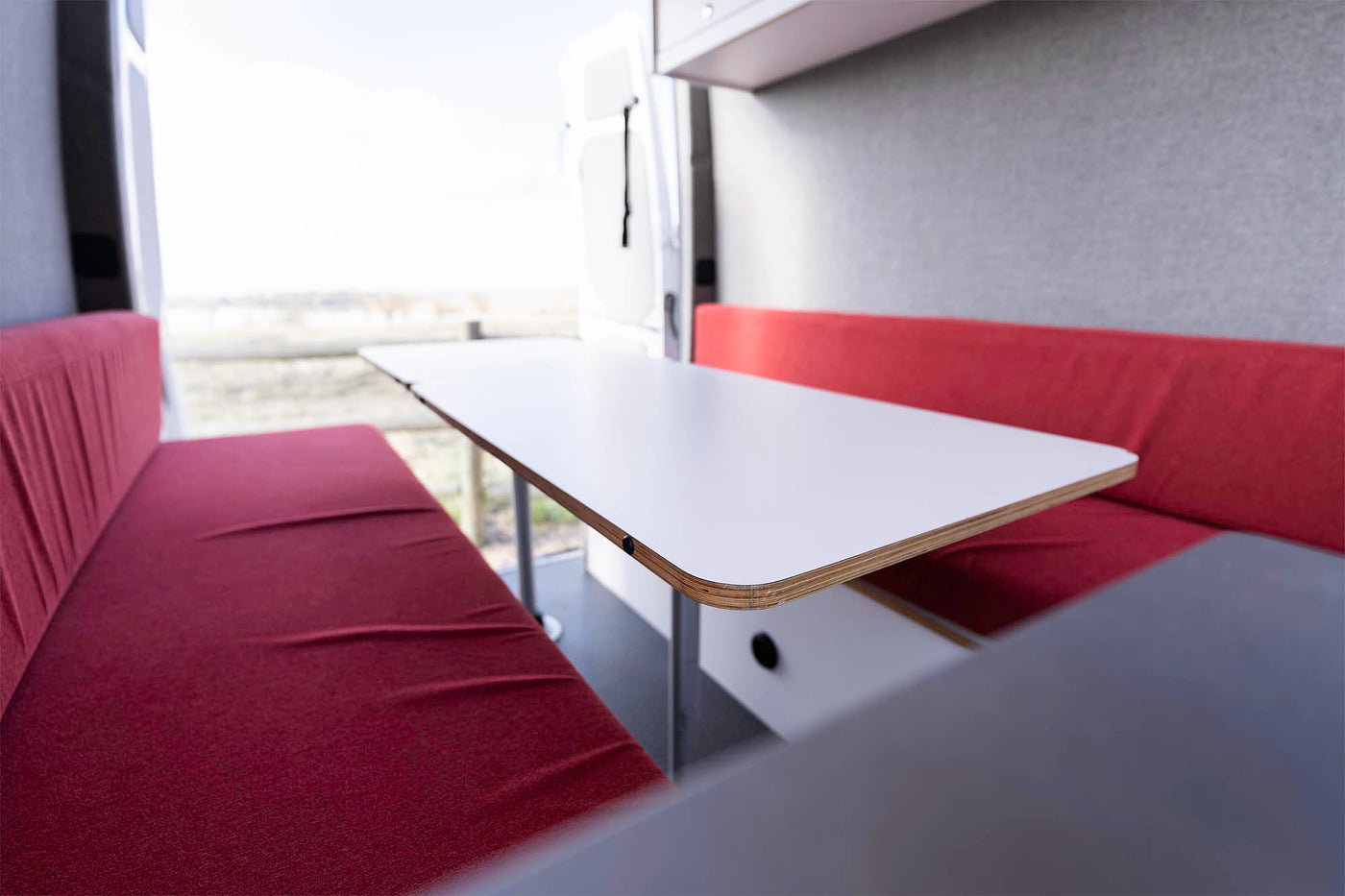 and overhead storage in a camper van.|Step into this RV rental — photo 8